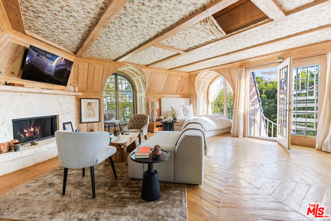 30870 Broad Beach Road Malibu, CA 90265 - Photo 20 of 28 a living room with furniture a fireplace and a flat screen tv