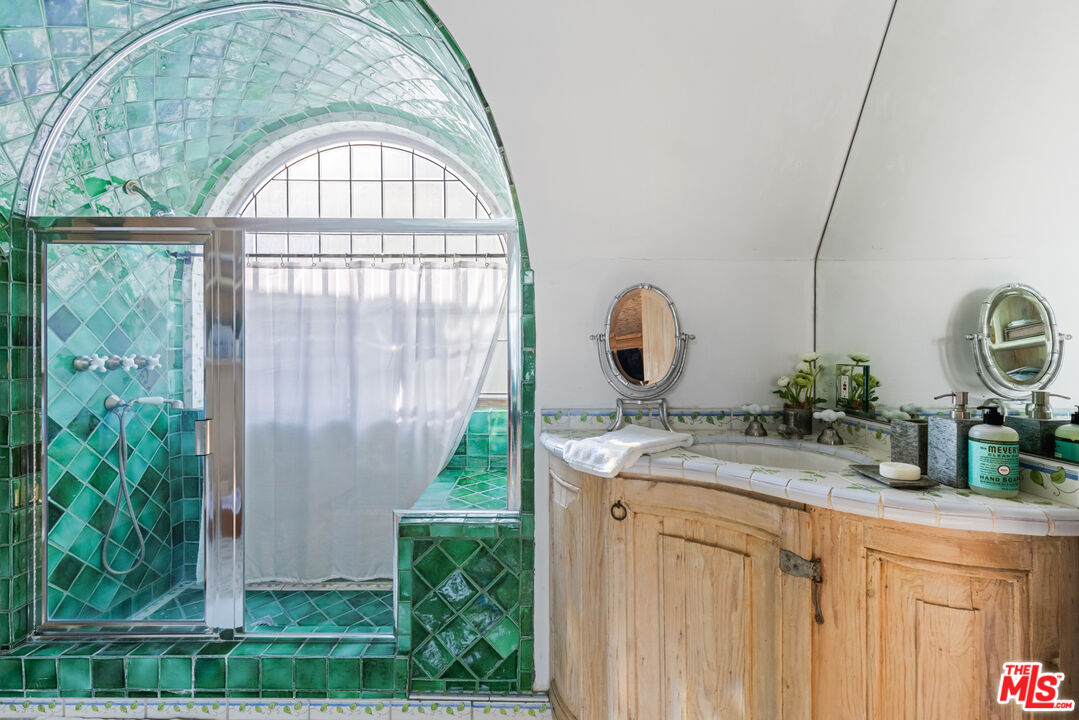 30870 Broad Beach Road Malibu, CA 90265 - Photo 23 of 28 a bathroom with a sink and a mirror
