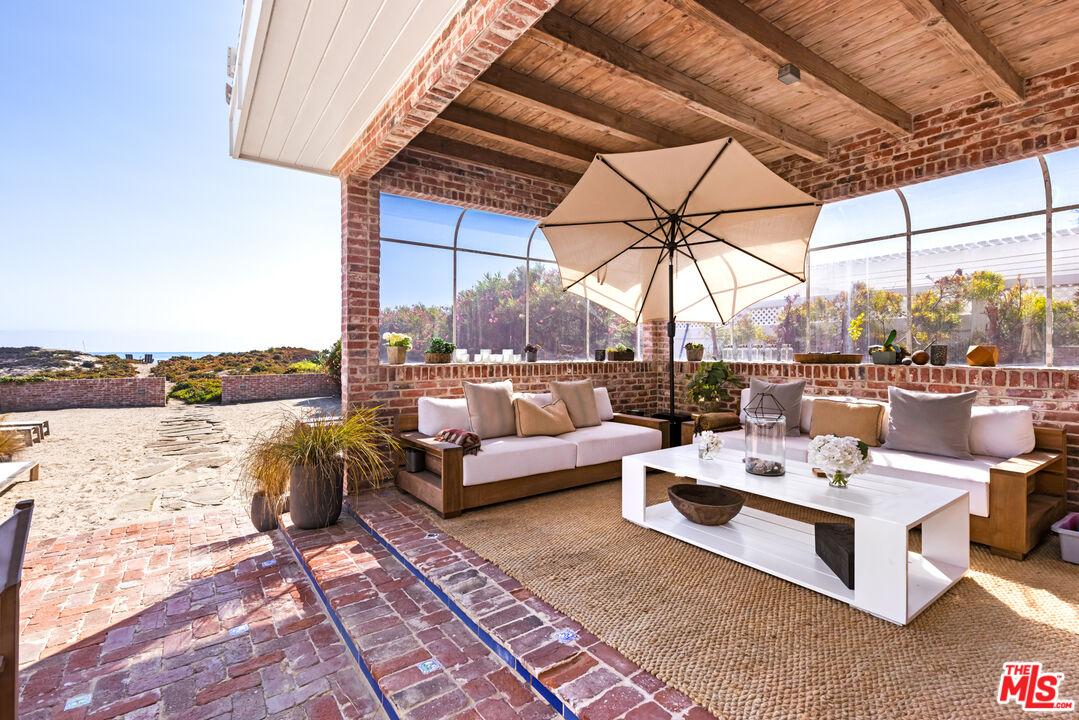 30870 Broad Beach Road Malibu, CA 90265 - Photo 4 of 28 a view of living room with patio and ocean view