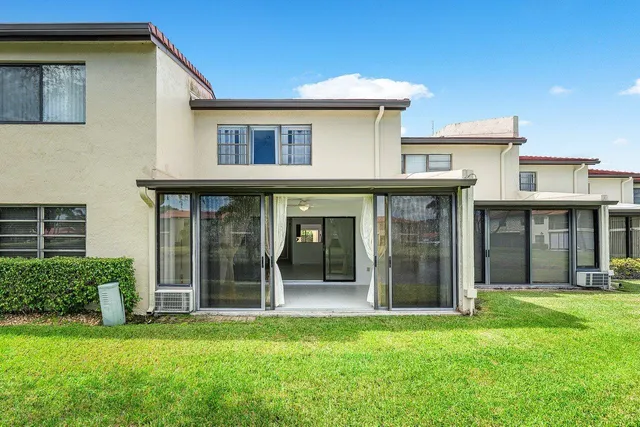 a view of a lake with houses in the background
