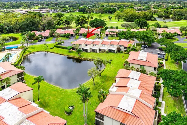 an aerial view of residential houses with outdoor space and street view