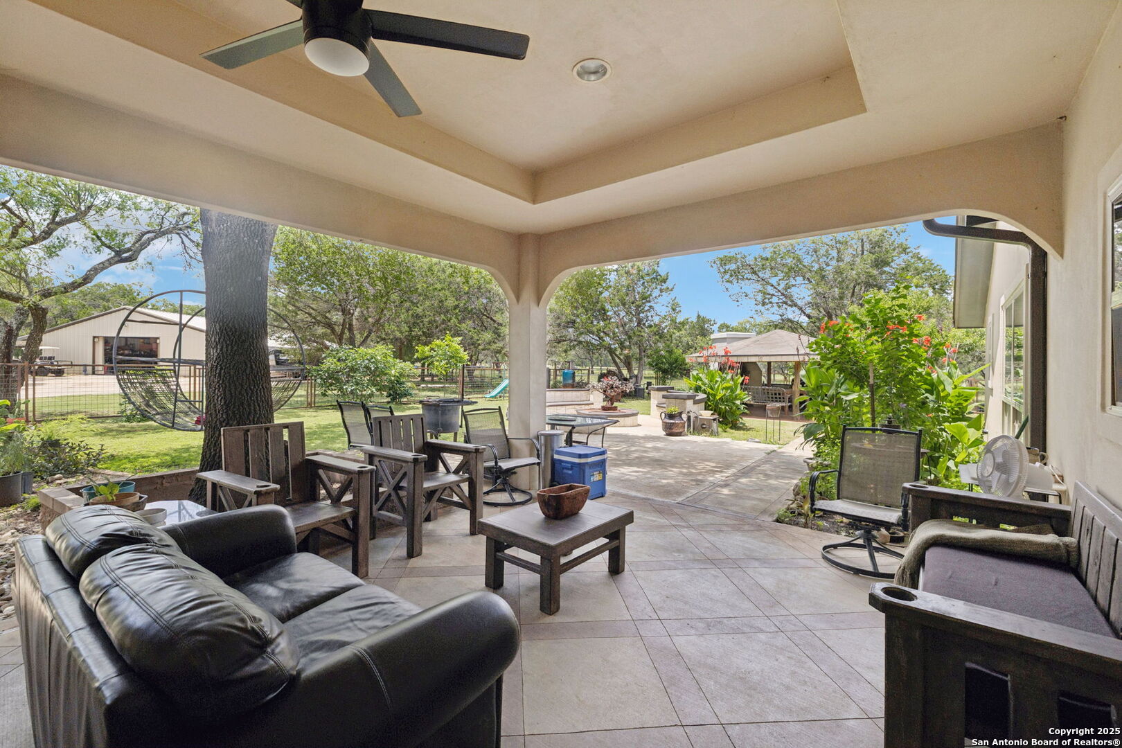 450 Georg Oaks Bulverde, TX 78163 - Photo 14 of 41 a living room with furniture and a floor to ceiling window