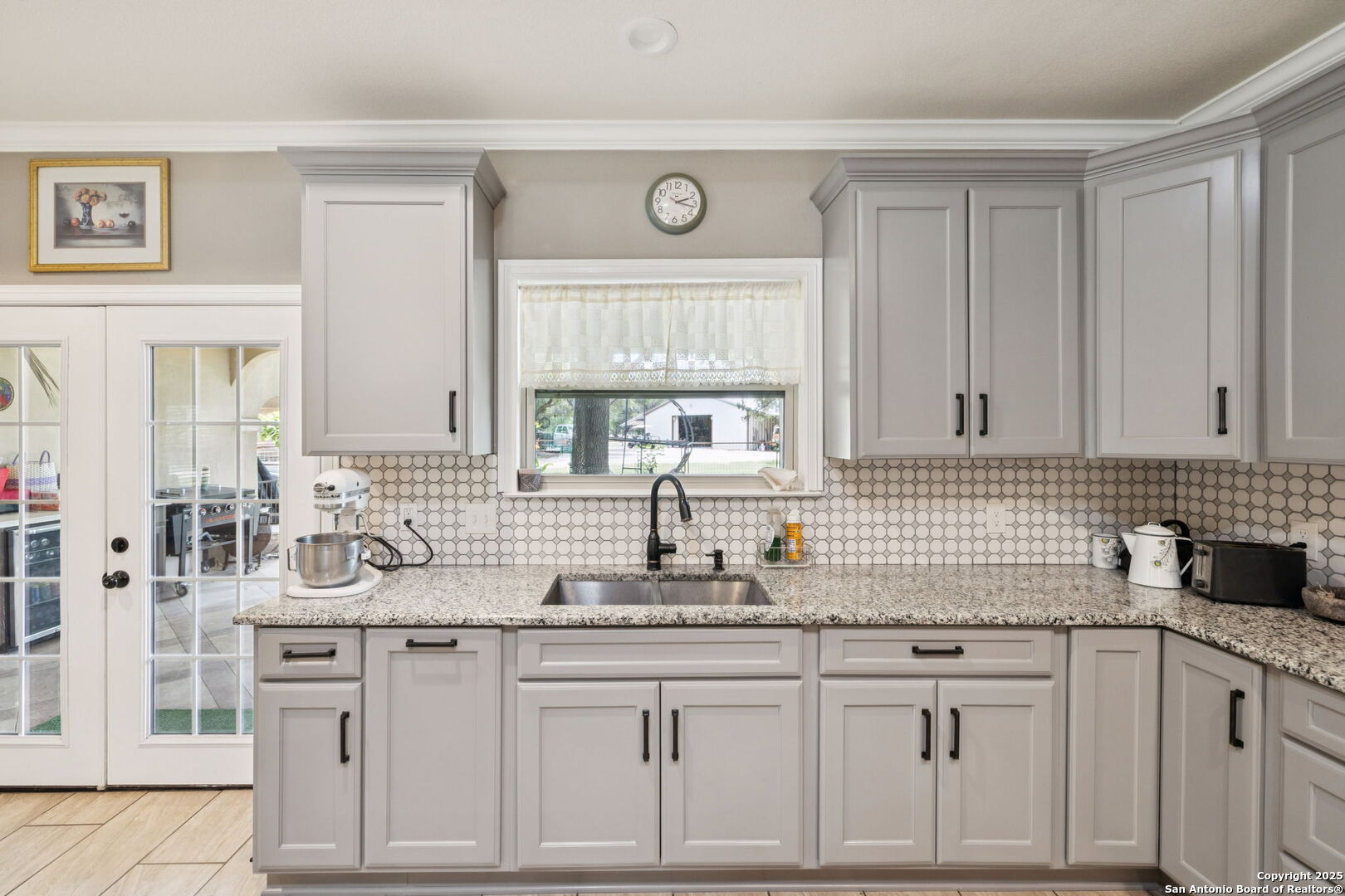 450 Georg Oaks Bulverde, TX 78163 - Photo 16 of 41 a kitchen with white cabinets and white appliances