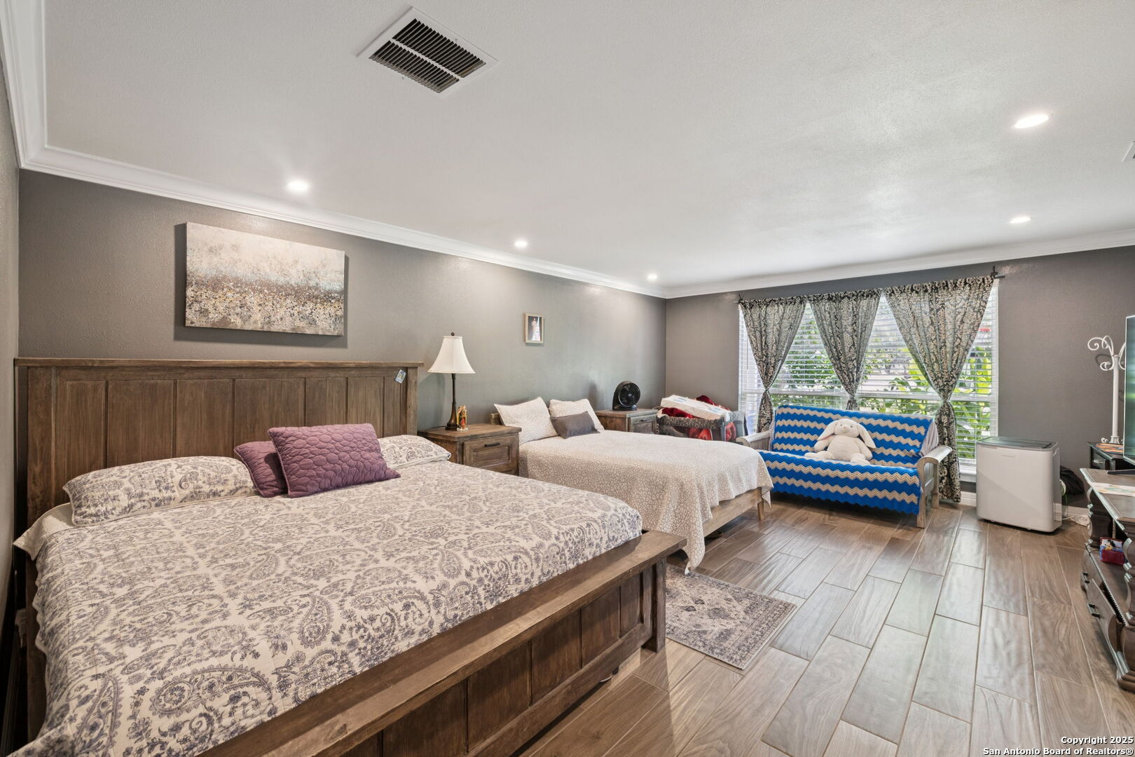 450 Georg Oaks Bulverde, TX 78163 - Photo 23 of 41 a bedroom with double bed and a large window