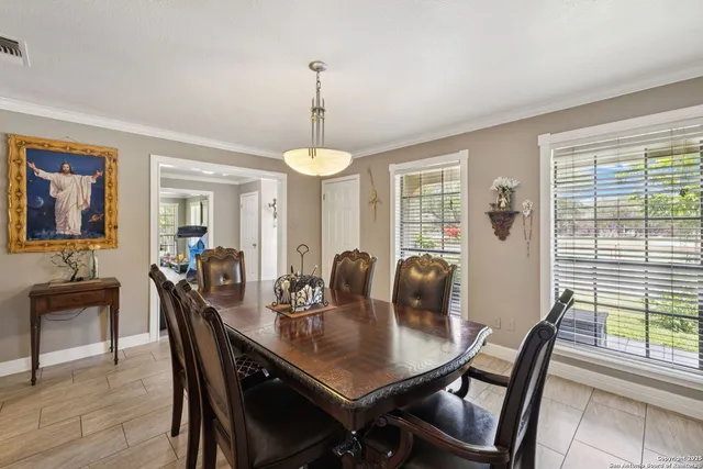 a view of a dining room with furniture window and outside view