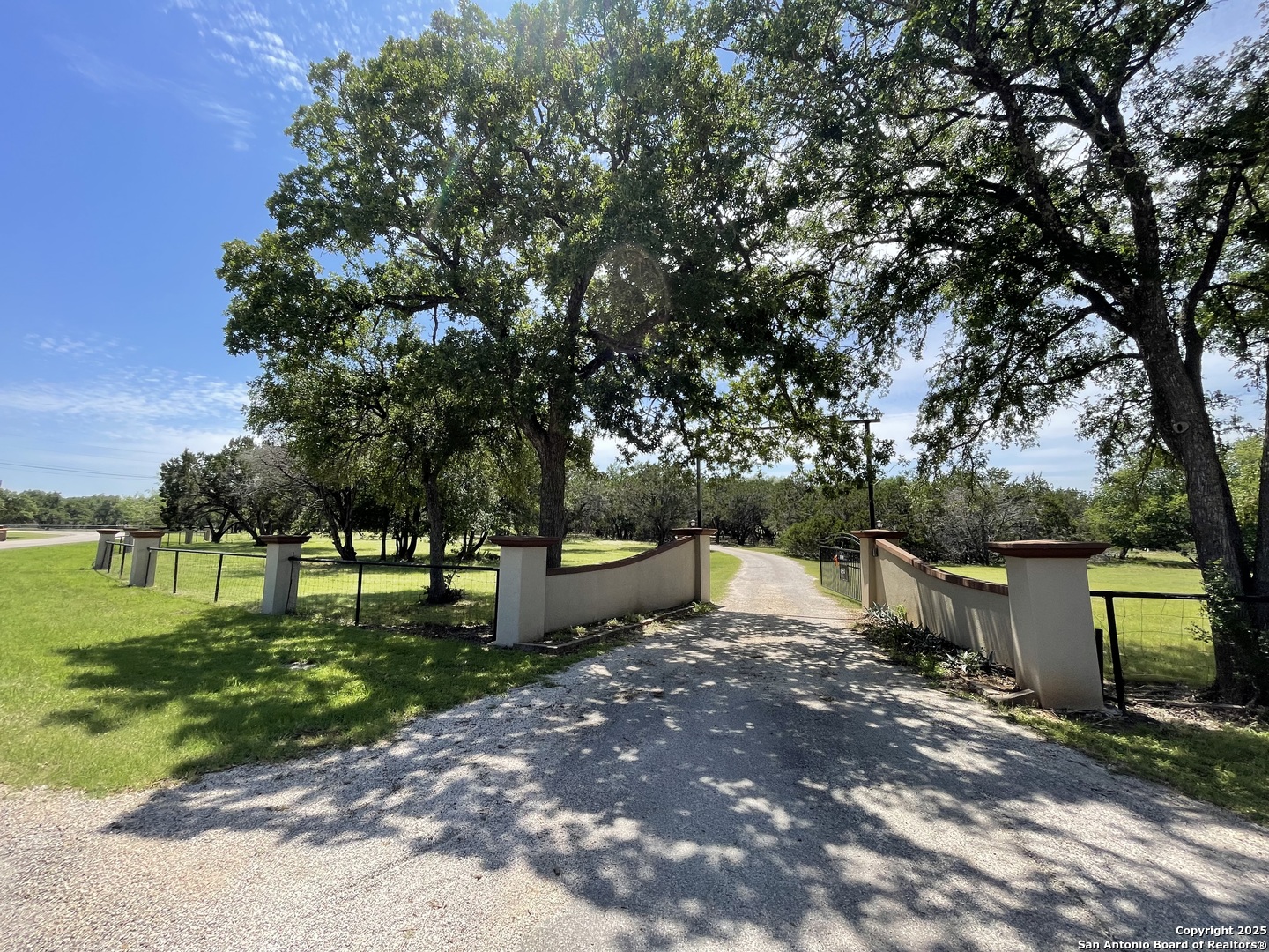 450 Georg Oaks Bulverde, TX 78163 - Photo 3 of 41 a backyard of a house with lots of green space