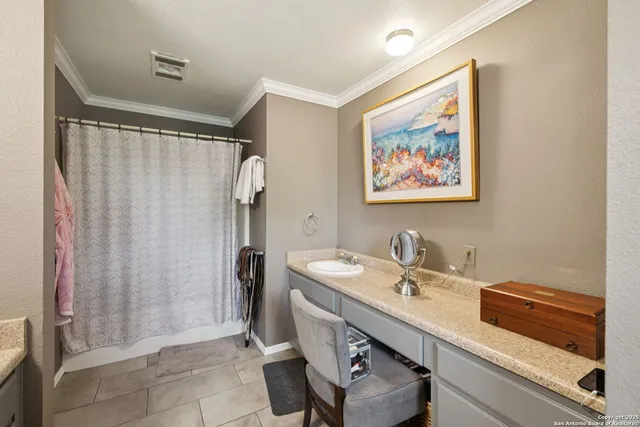 a bathroom with a sink a mirror and a shower