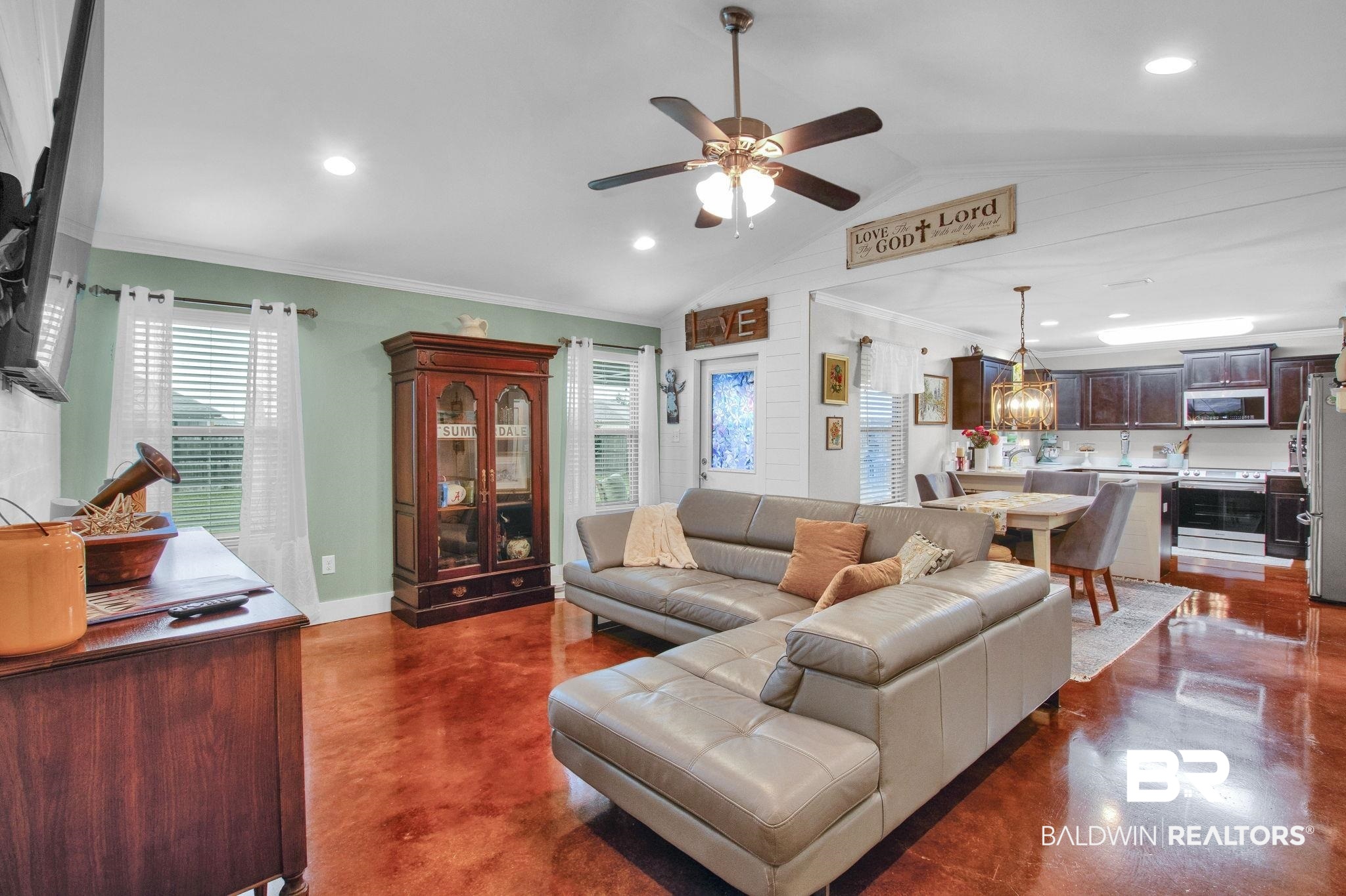 203 Lakefront Circle Summerdale, AL 36580 - Photo 15 of 69 Living room featuring ceiling fan, lofted ceiling, and ornamental molding