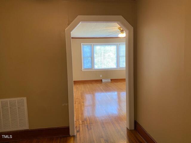 9081 Virgilina Road Roxboro, NC 27574 - Photo 32 of 36 Hallway looking back towards livingroom with fancy walk through