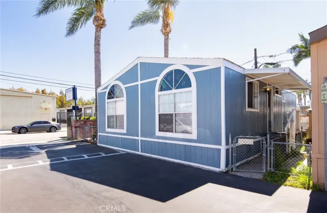a view of a street with cars parked on road