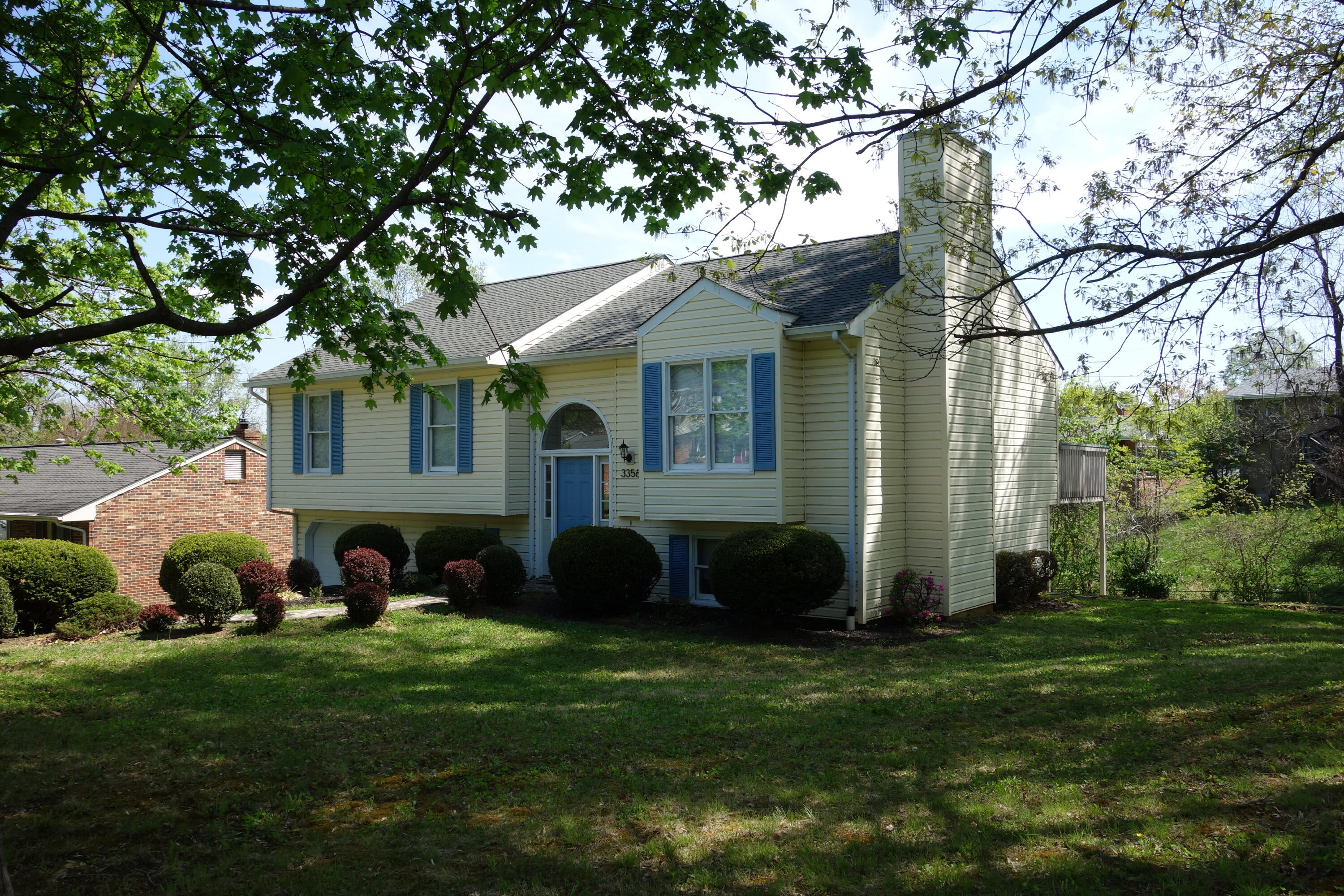 a view of an house with backyard space and garden