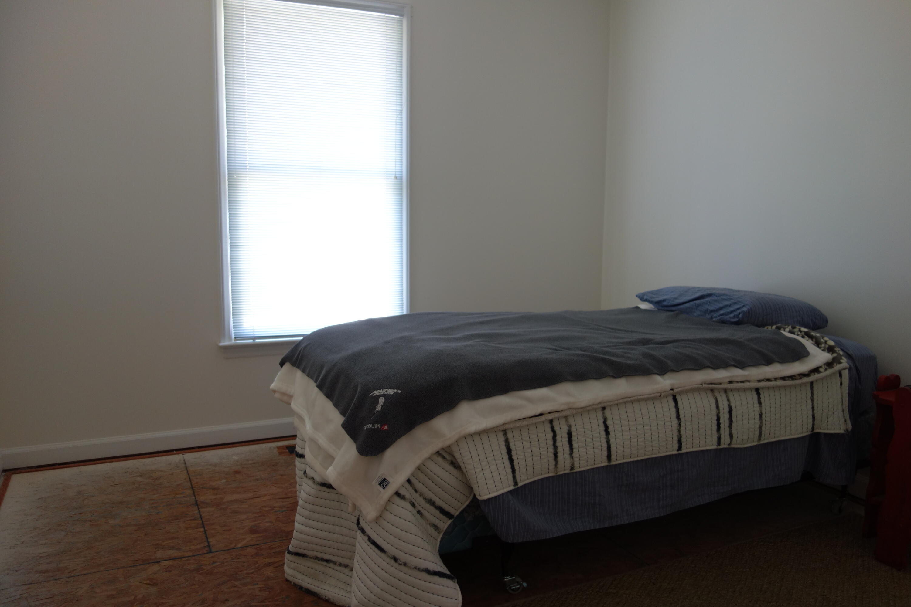 3356 Kenwick Trail Roanoke, VA 24018 - Photo 19 of 39 a bed sitting in a bedroom next to a window
