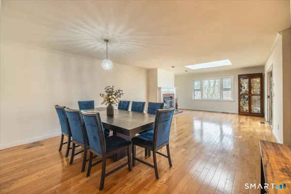 a view of a dining room with furniture and wooden floor