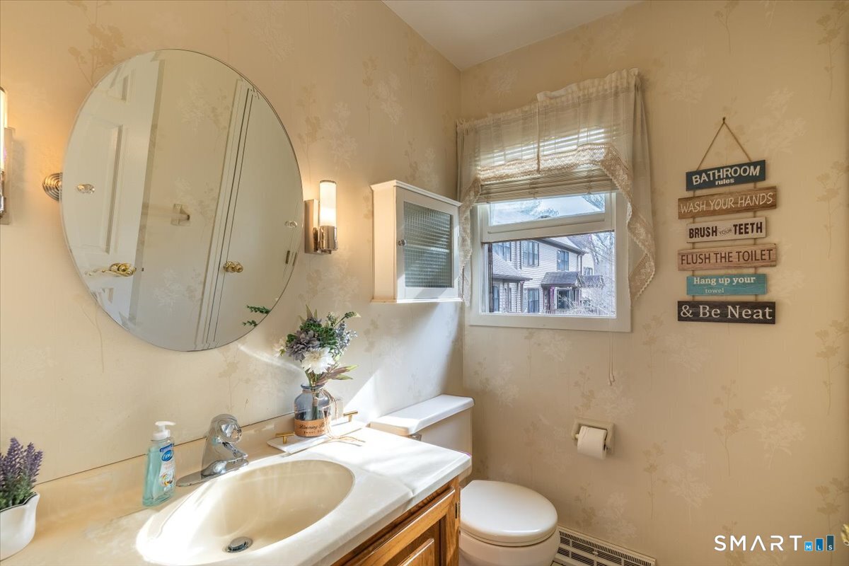 10 Juniper Circle, Unit 10 Monroe, CT 06468 - Photo 19 of 52 a bathroom with a sink a toilet and shower
