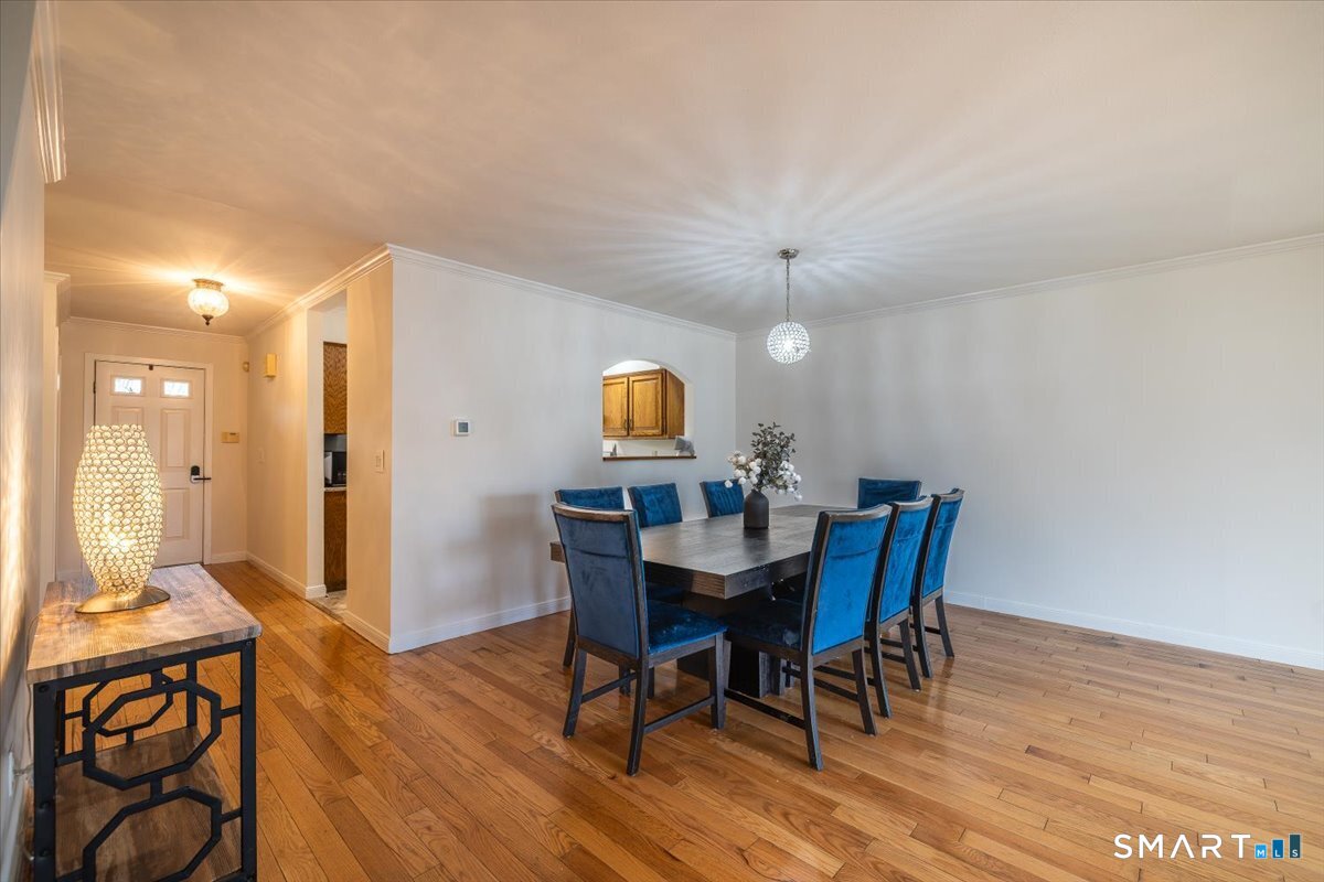 10 Juniper Circle, Unit 10 Monroe, CT 06468 - Photo 23 of 52 a view of a dining room with furniture and wooden floor