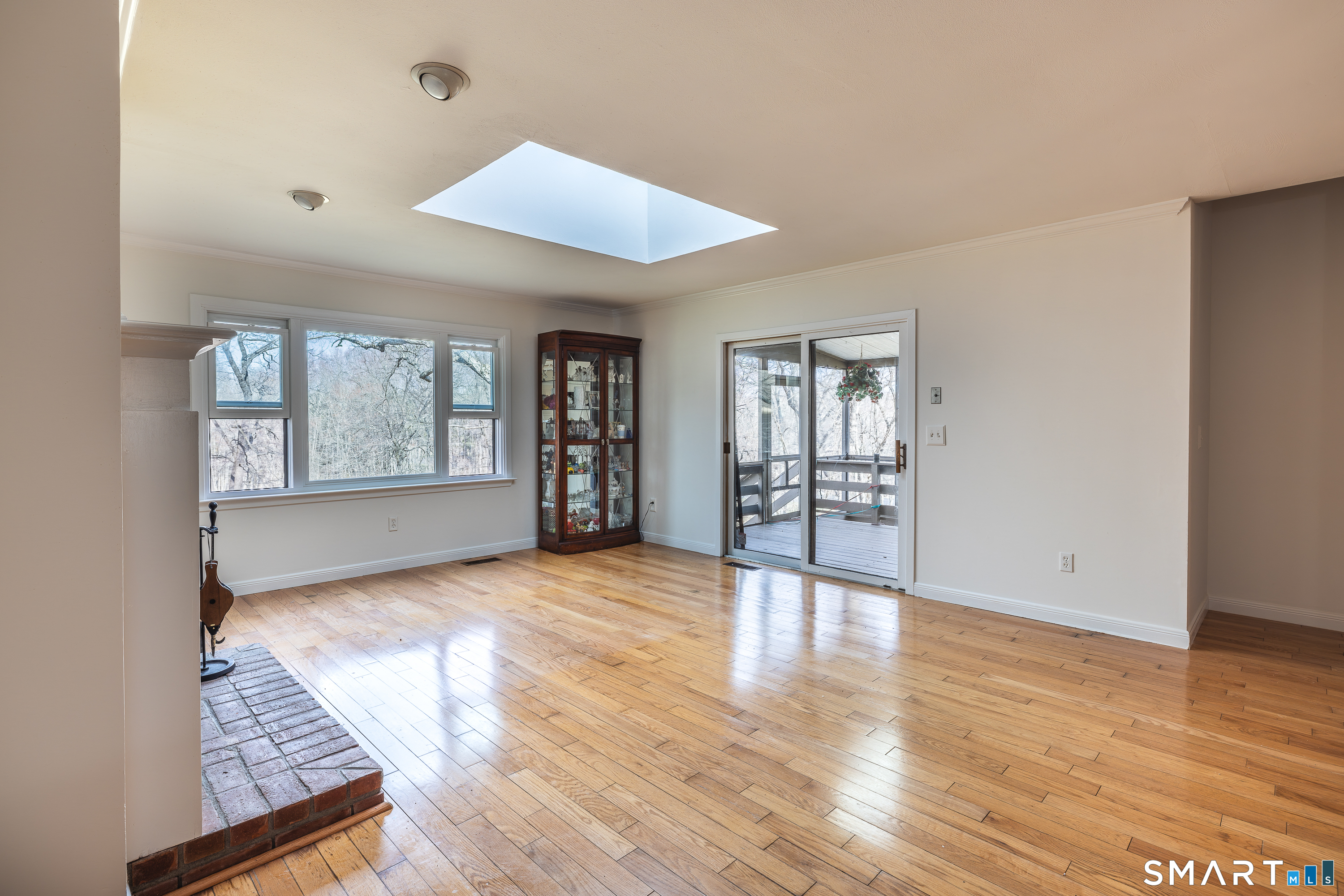 10 Juniper Circle, Unit 10 Monroe, CT 06468 - Photo 24 of 52 an empty room with wooden floor and windows