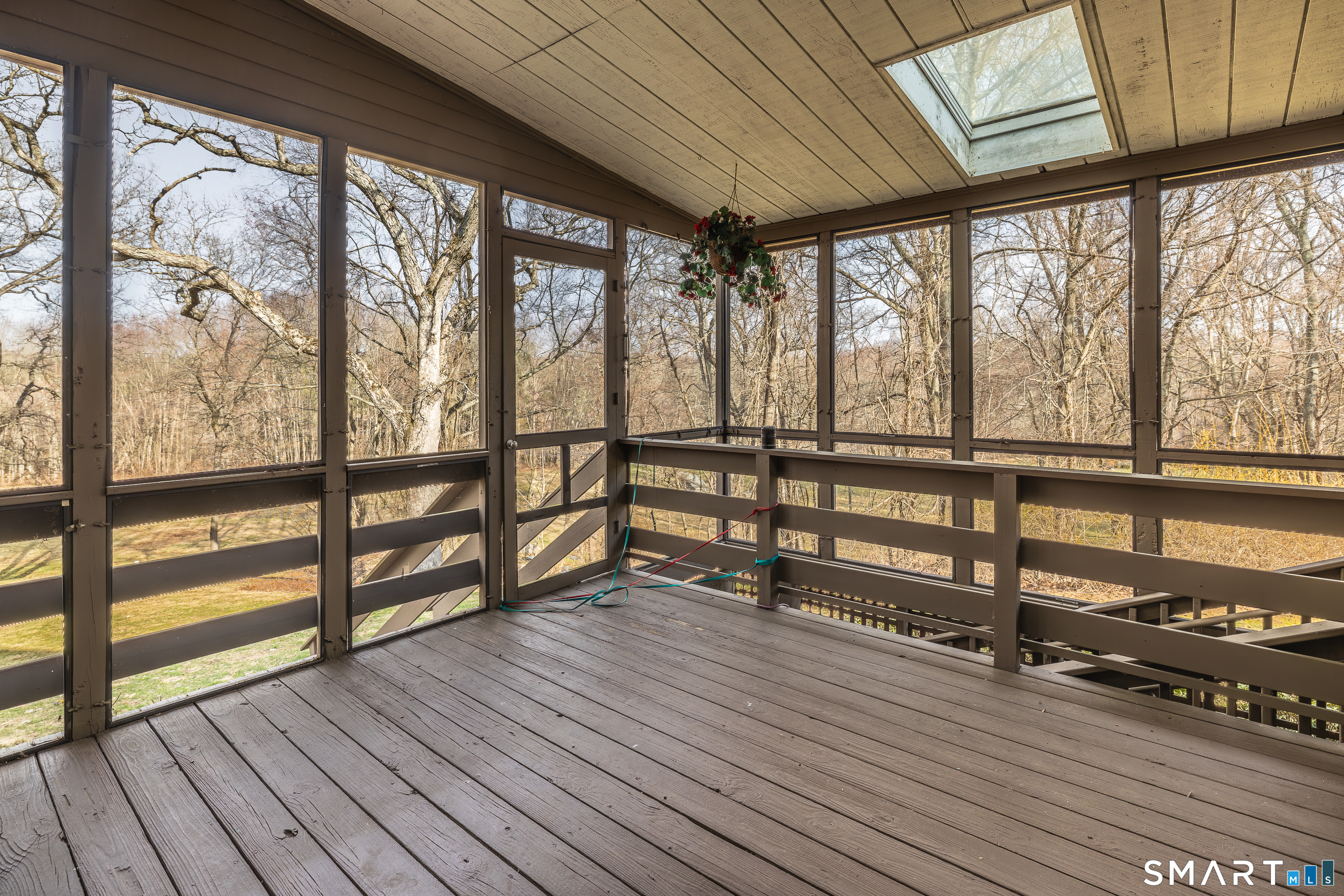 10 Juniper Circle, Unit 10 Monroe, CT 06468 - Photo 26 of 52 a view of an empty room with wooden floor and windows