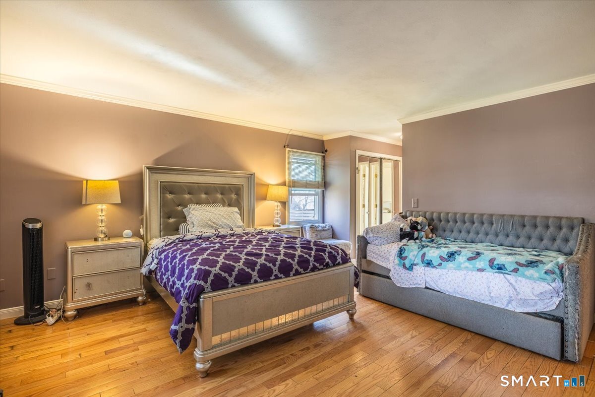10 Juniper Circle, Unit 10 Monroe, CT 06468 - Photo 31 of 52 a bedroom with a bed and window