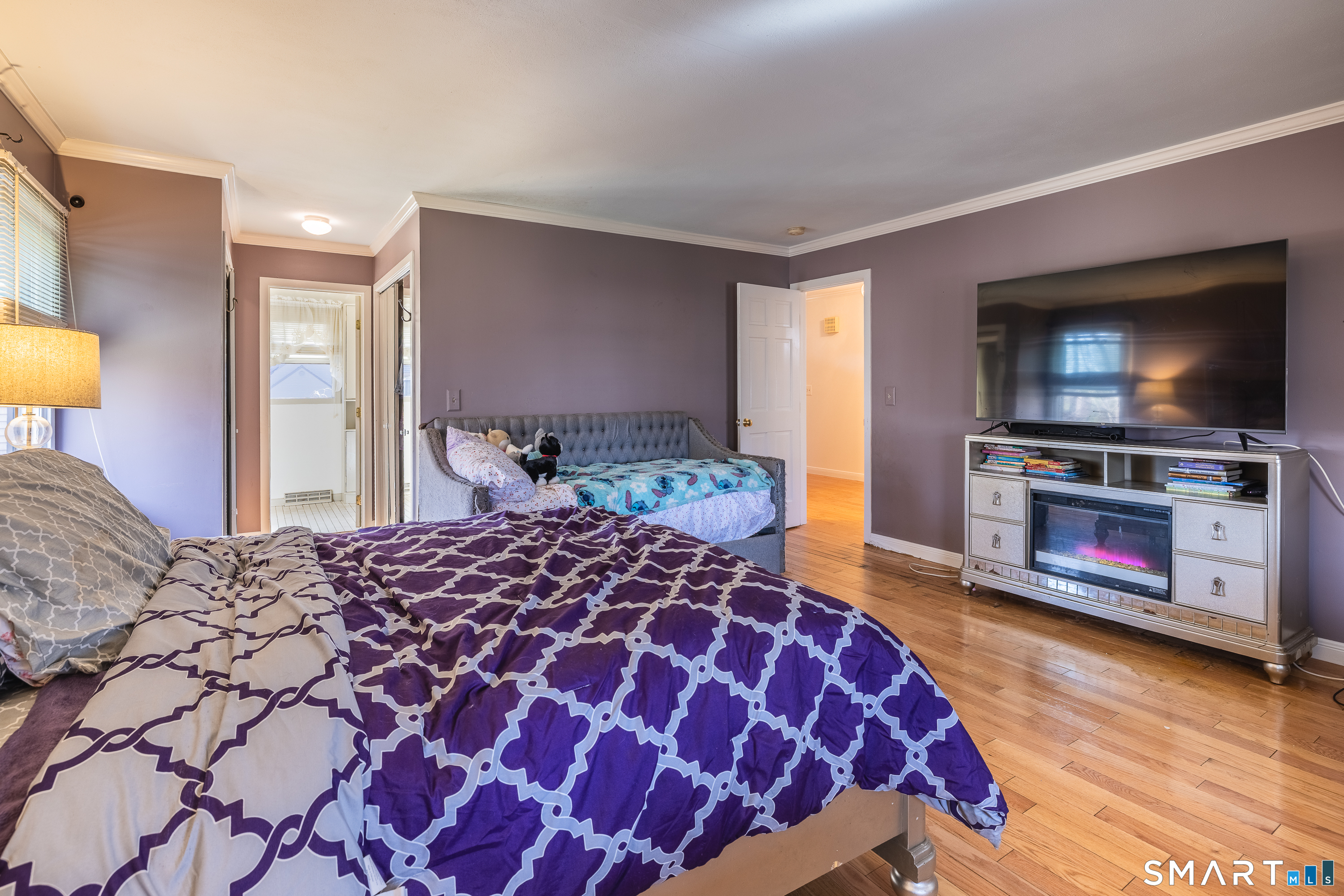 10 Juniper Circle, Unit 10 Monroe, CT 06468 - Photo 34 of 52 a bedroom with a bed and a flat screen tv