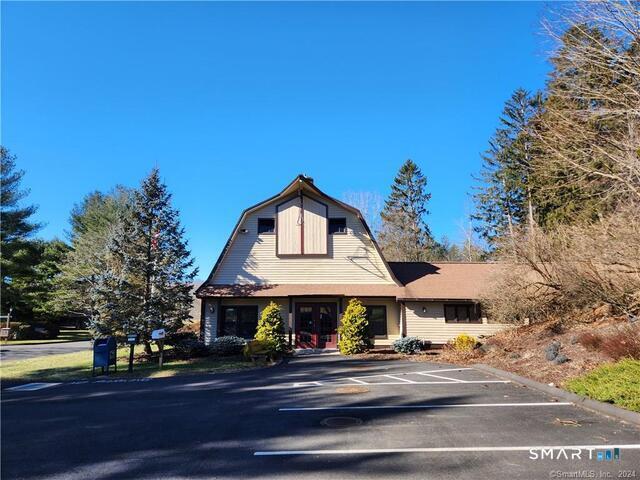 10 Juniper Circle, Unit 10 Monroe, CT 06468 - Photo 49 of 52 a front view of a building with streets and trees
