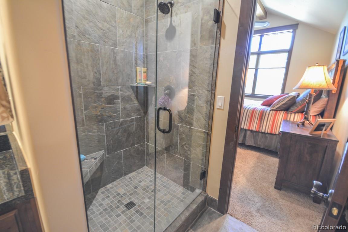 833 Independence Road Keystone, CO 80435 - Photo 24 of 38 a bathroom with a glass shower door