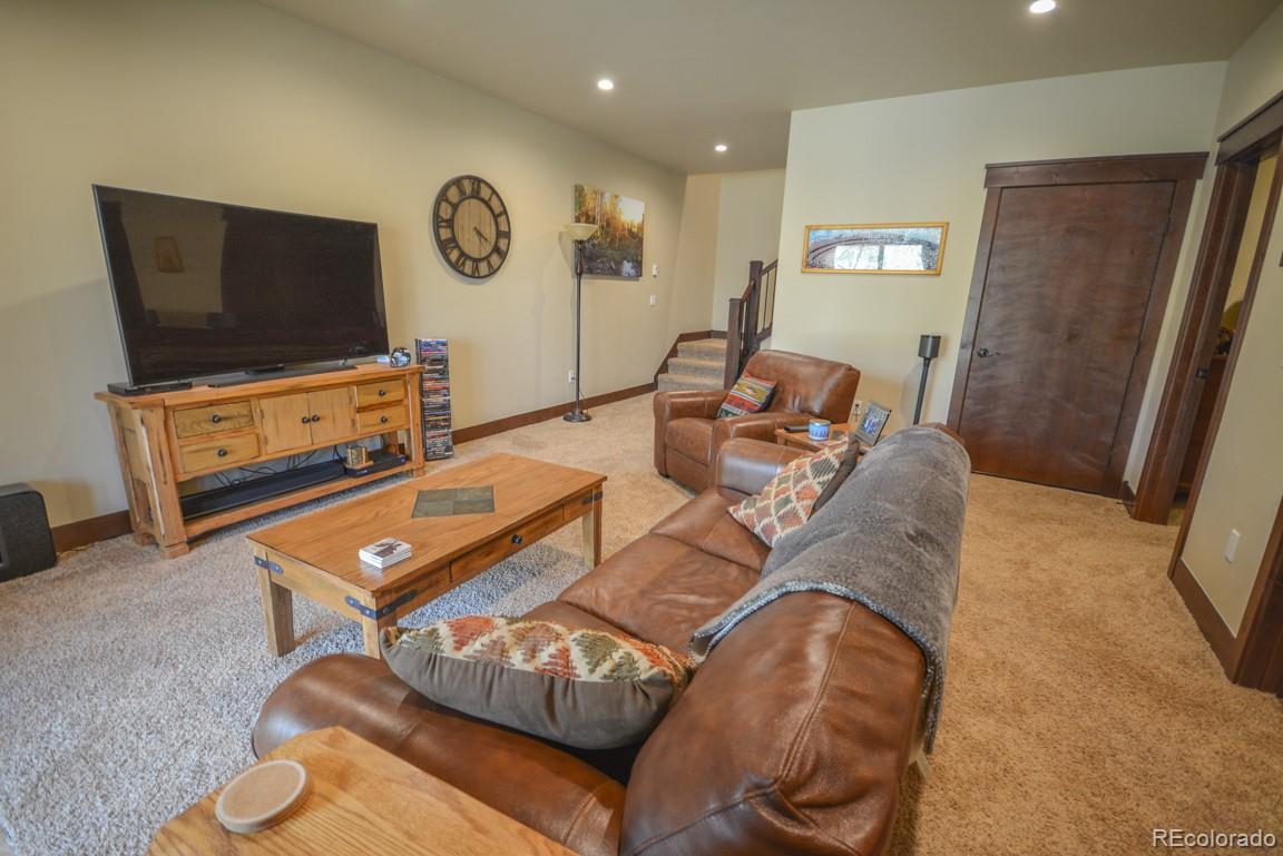 833 Independence Road Keystone, CO 80435 - Photo 29 of 38 a living room with furniture and a flat screen tv