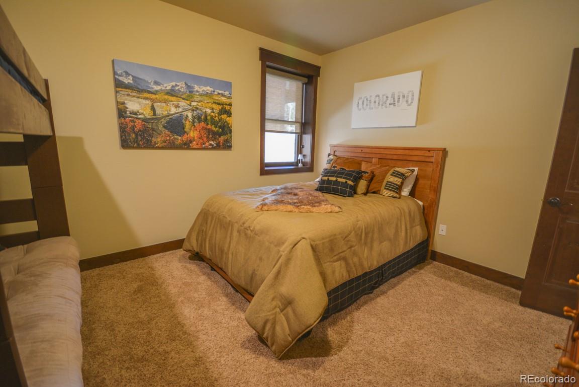 833 Independence Road Keystone, CO 80435 - Photo 31 of 38 a bedroom with a bed and wall painting