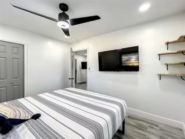 a bedroom with bed and a window