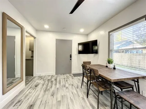 a bedroom with a large bed and a large window