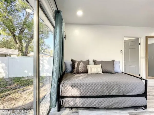 a kitchen with a refrigerator sink and cabinets