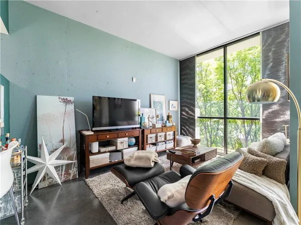 a living room with furniture and a flat screen tv