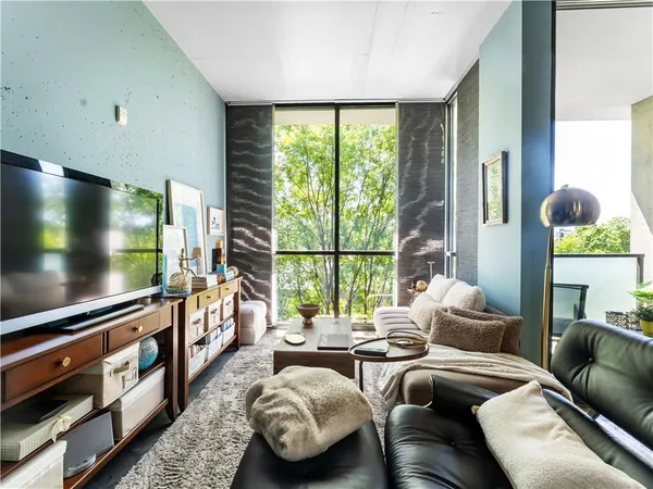 a living room with furniture and a flat screen tv