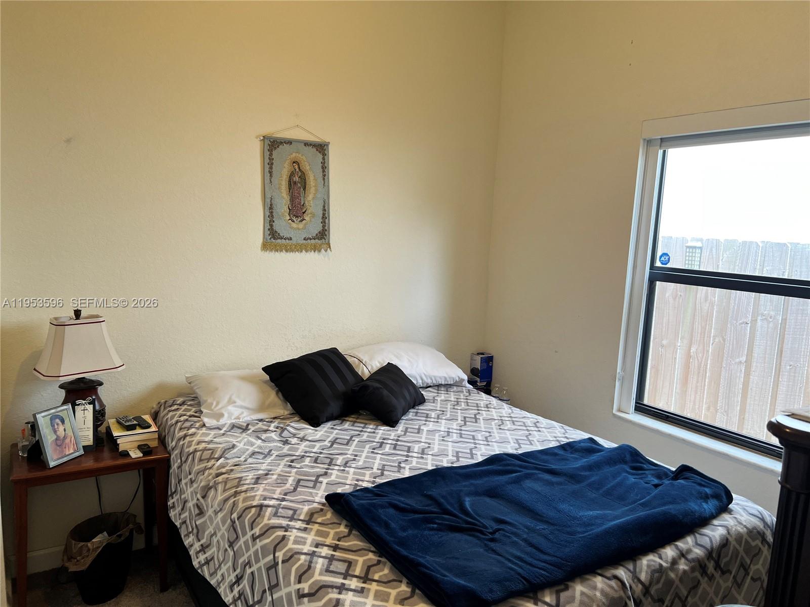 134 Northeast 23rd Terrace Homestead, FL 33033 - Photo 12 of 17 a bedroom with a bed window and a window