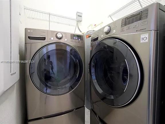 134 Northeast 23rd Terrace Homestead, FL 33033 - Photo 16 of 17 a utility room with dryer and washer