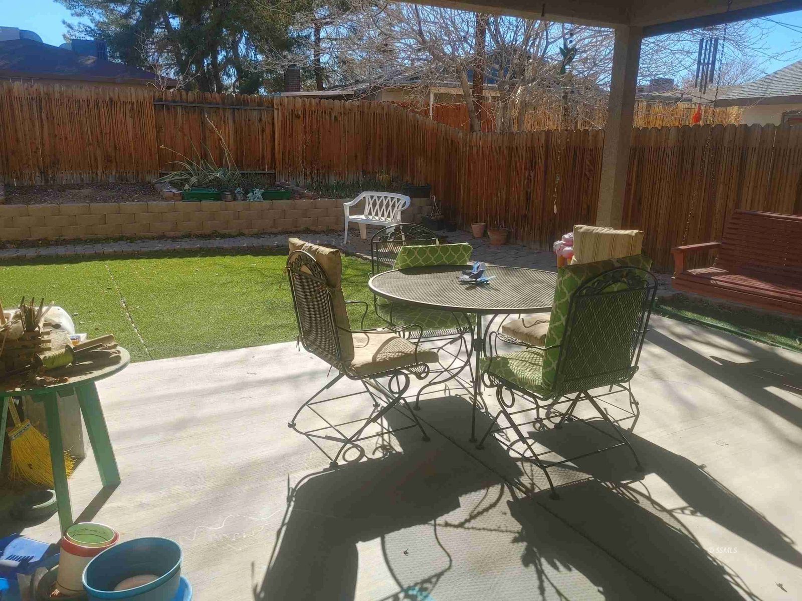 1145 West St George Avenue Ridgecrest, CA 93555 - Photo 16 of 16 a view of a chairs and table in backyard