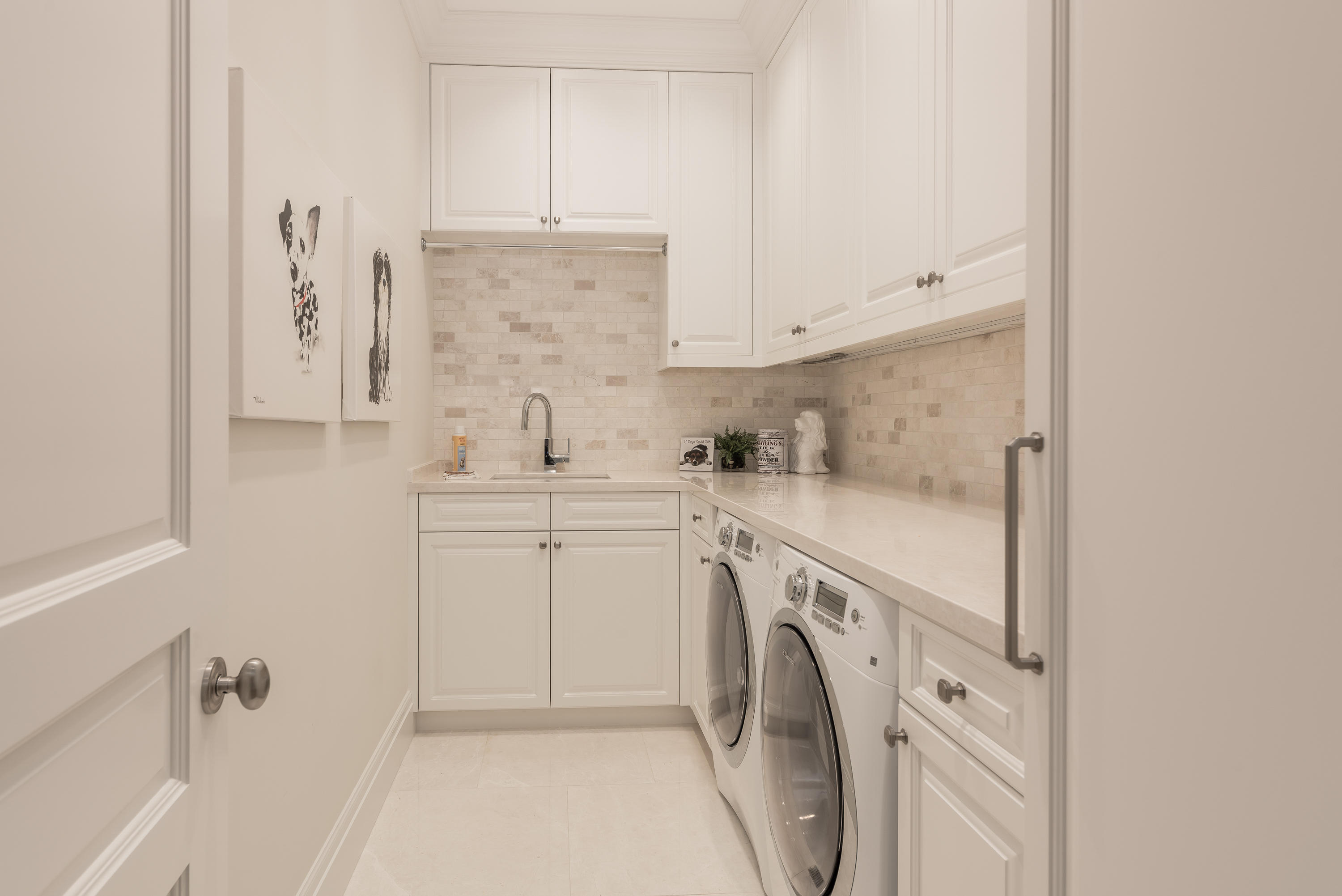 651 Northeast 45th Road Boca Raton, FL 33431 - Photo 16 of 23 a view of a kitchen with white cabinets