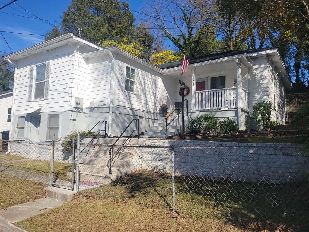 102 Smith Street Northeast Rome, GA 30161 - Photo 1 of 1 a view of a house with a yard
