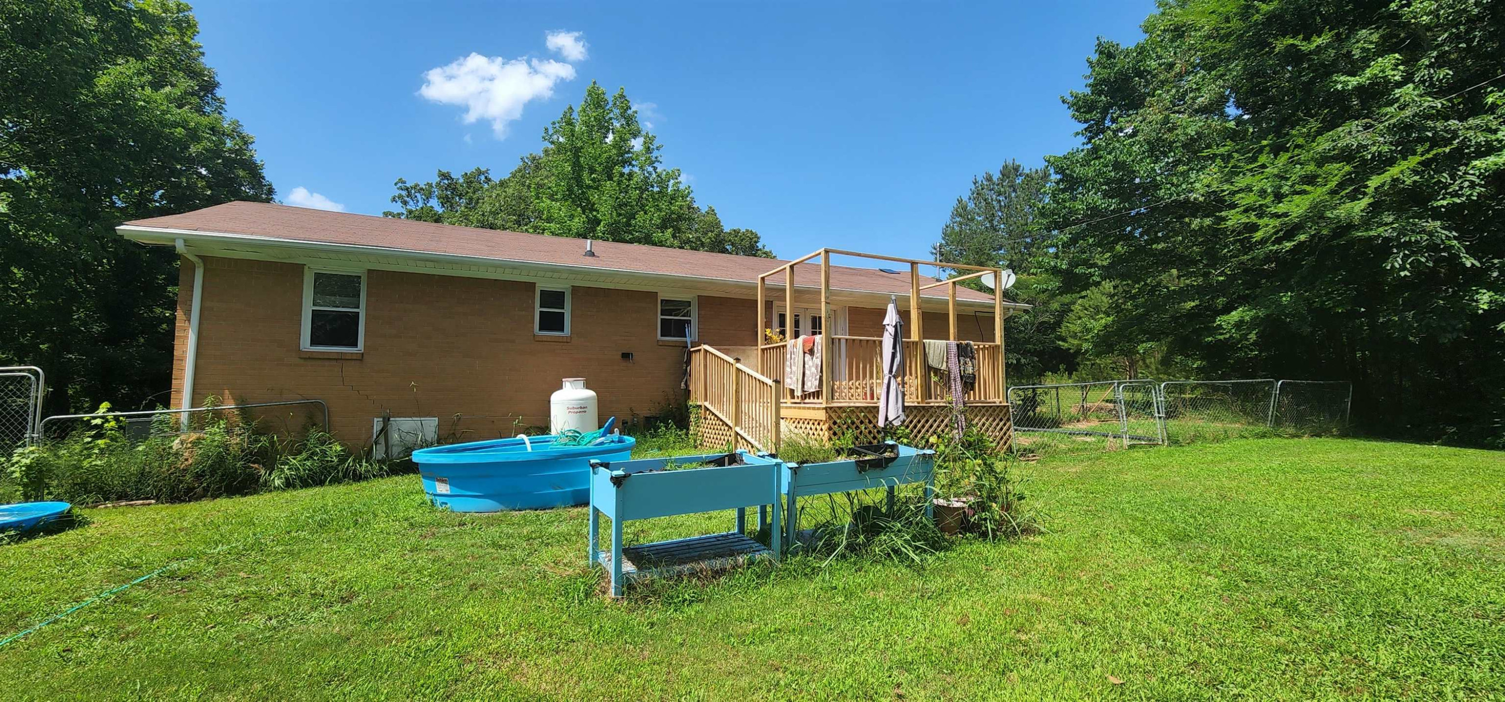 60 McAbee Road Jackson, TN 38301 - Photo 18 of 18 a backyard of a house with table and chairs