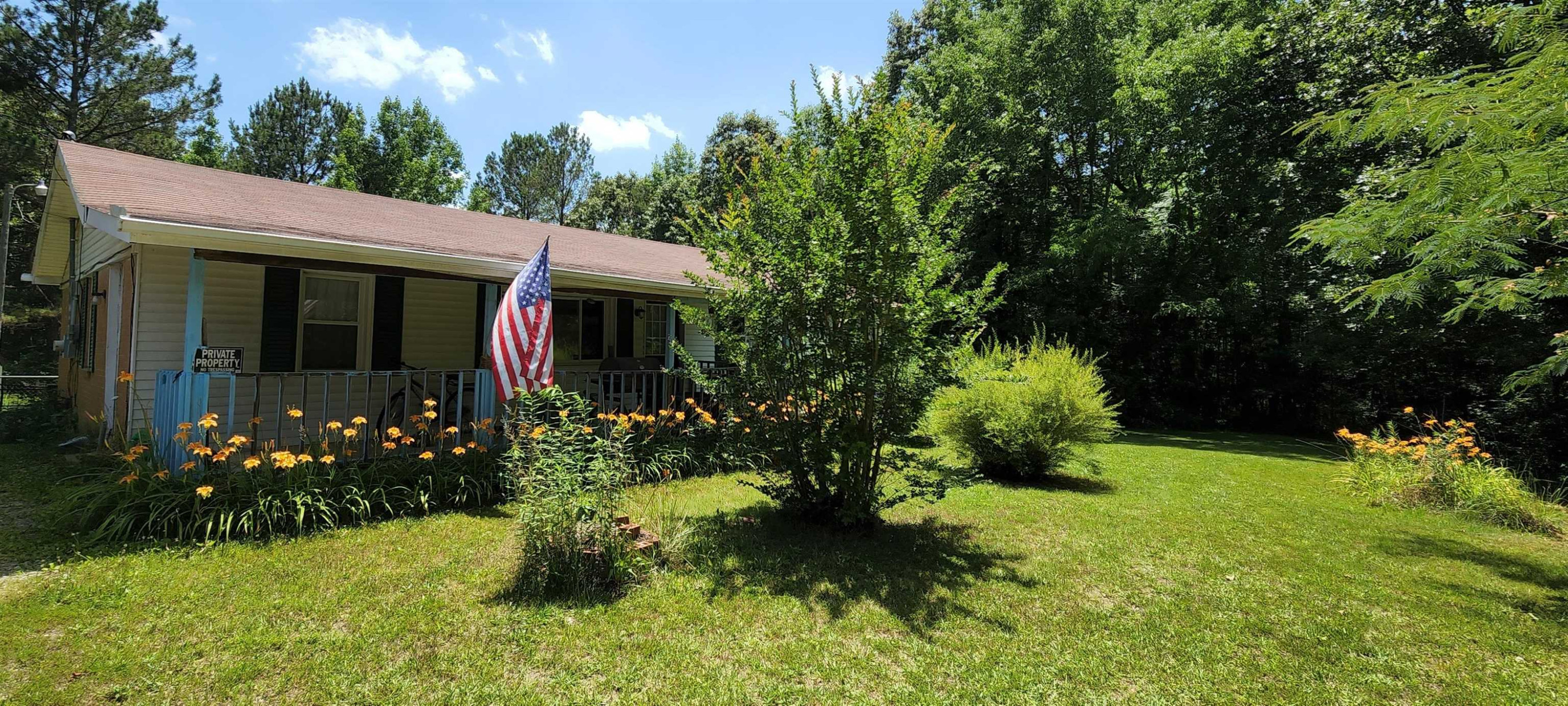 60 McAbee Road Jackson, TN 38301 - Photo 2 of 18 a view of a house with a yard and garden