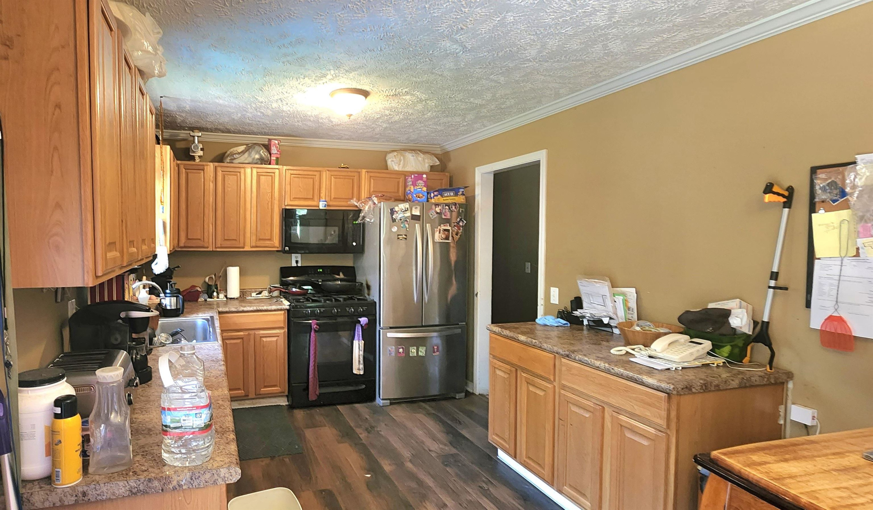 60 McAbee Road Jackson, TN 38301 - Photo 7 of 18 a kitchen with sink refrigerator and cabinets