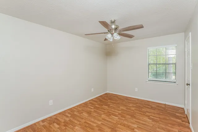 a bathroom with a sink and mirror with toilet