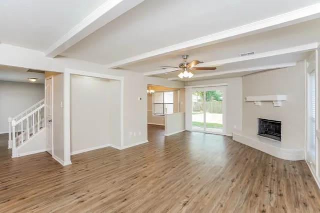a kitchen with stainless steel appliances a refrigerator sink and microwave