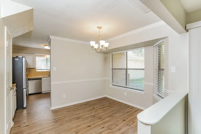a kitchen with a sink a stove and cabinets
