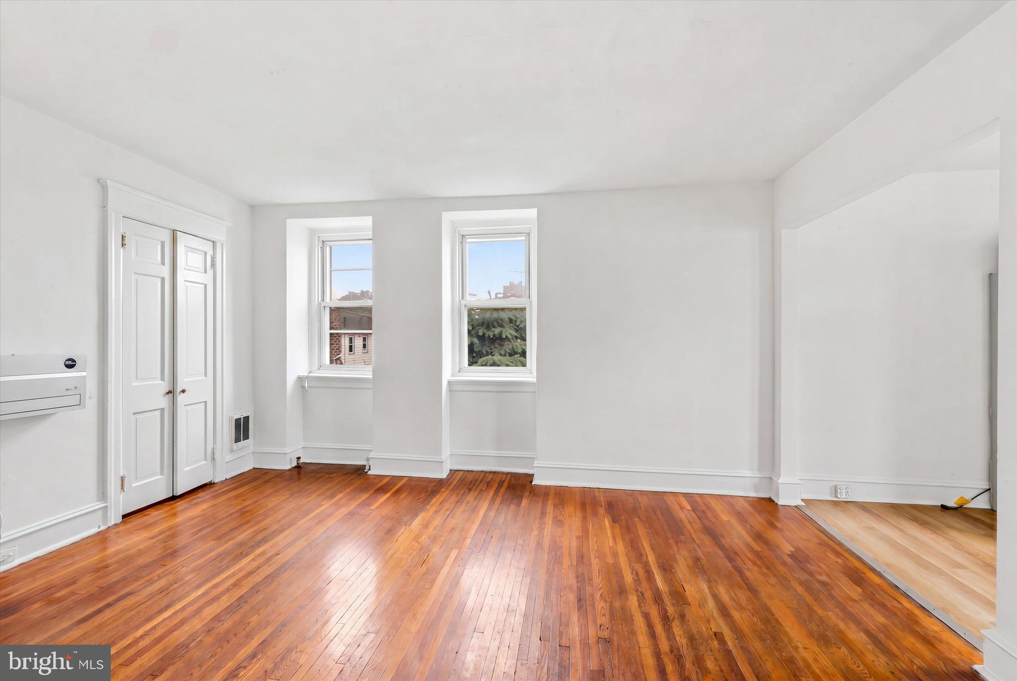 55 Richfield Road Upper Darby, PA 19082 - Photo 25 of 33 an empty room with wooden floor and windows