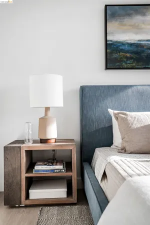 a living room with furniture and a lamp