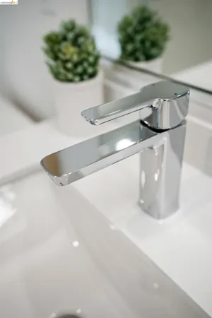 a bedroom with a bed and lamp