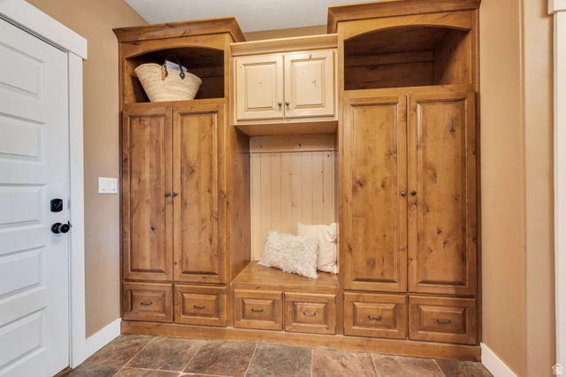 1355 West 1000 South Mapleton, UT 84664 - Photo 19 of 68 Built-in wood-finish cabinetry featuring storage compartments, drawers, and an integrated bench seating area