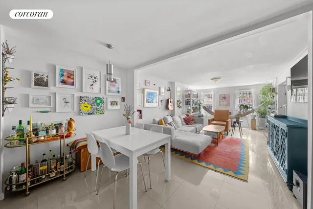 a living room with furniture flat screen tv and a couch