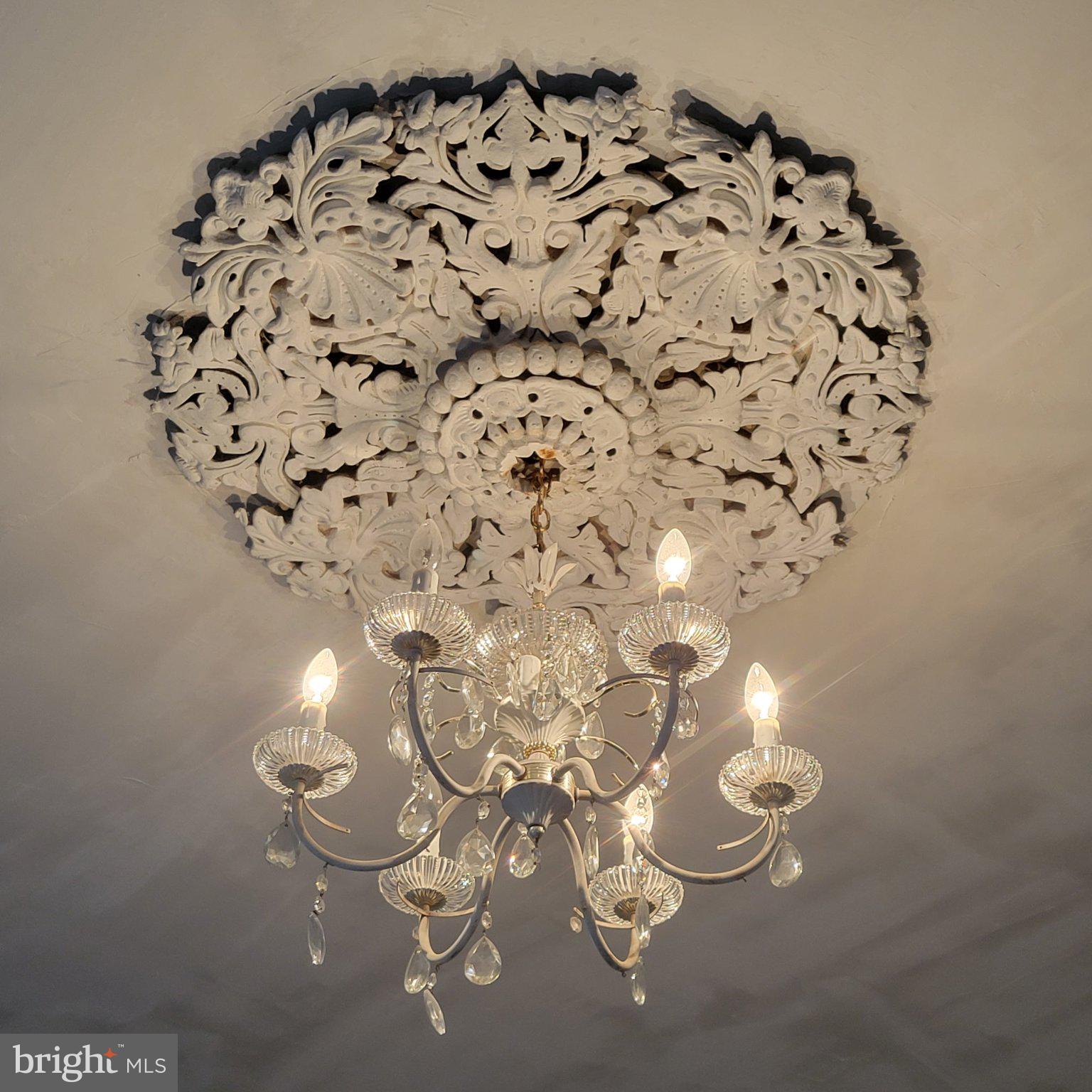 22109 Aquasco Road Aquasco, MD 20608 - Photo 27 of 34 Elegant chandelier beneath ornate ceiling.
