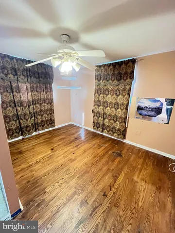 a view of a livingroom with wooden floor